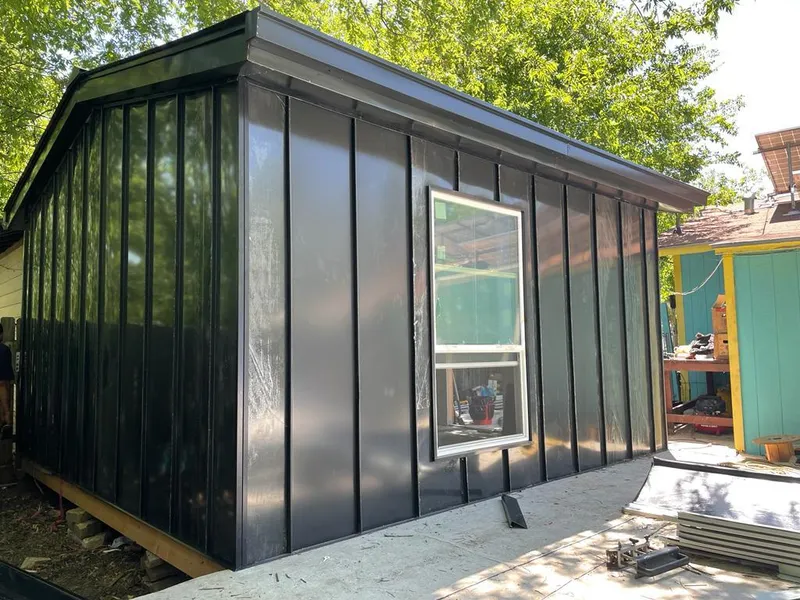 Black standing seam metal wall panels for Roof Inspection in Jupiter Farms